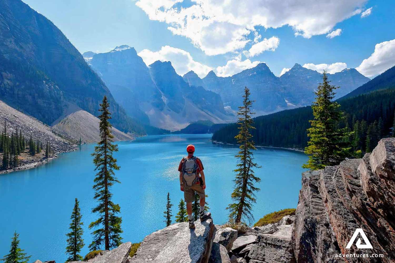 man hiking near moraine lake in banff national park