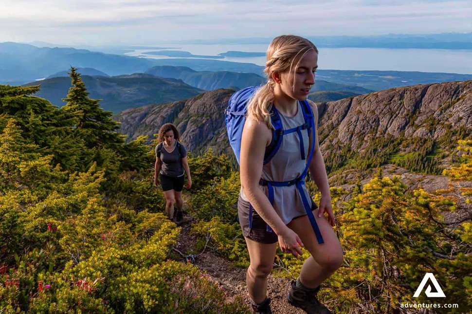 woman hiking wild pacific trail mountains