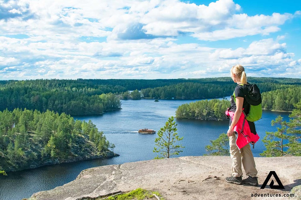 woman enjoying the lake view in finland