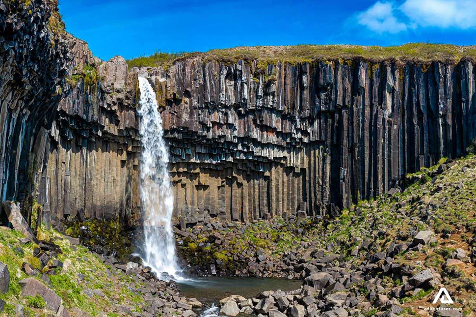 a view of svartifoss waterfall in summer