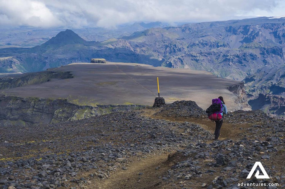 woman trekking fimmvorduhals trail in iceland