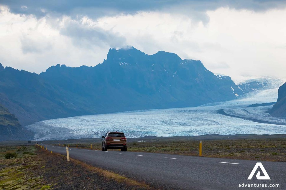 car on a road near skaftafell in south iceland