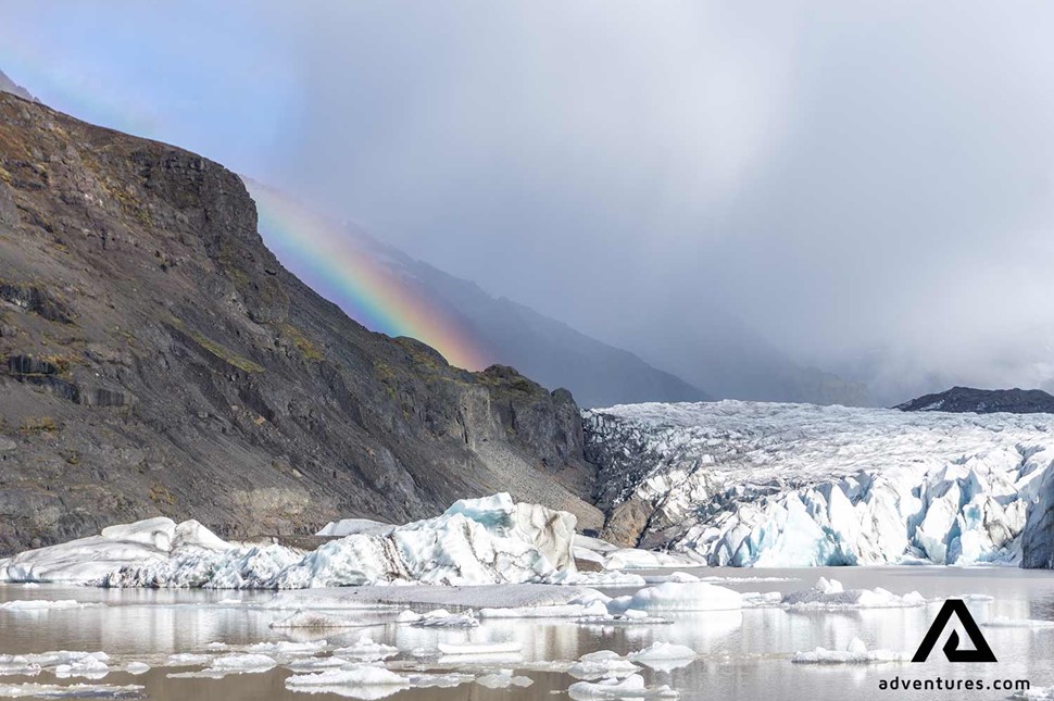 rainbow near svinafellsjokull glacier in south iceland