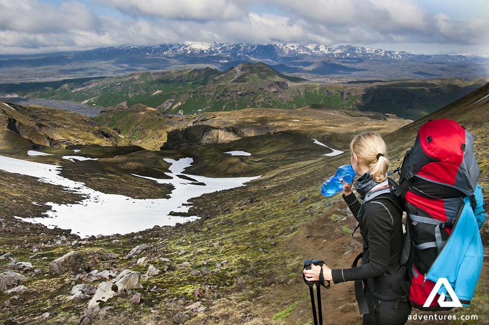 woman trekking in thorsmork valley in iceland