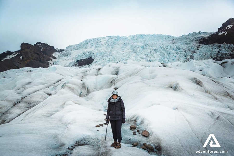 A woman standing on the glacier