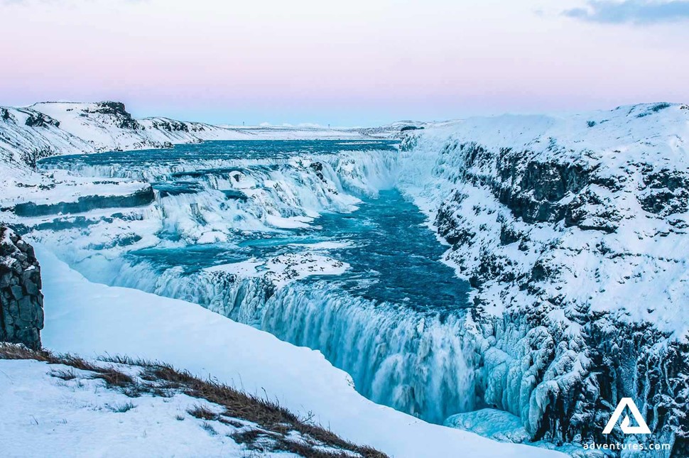 aerial view of gullfoss waterfall in winter at sunset