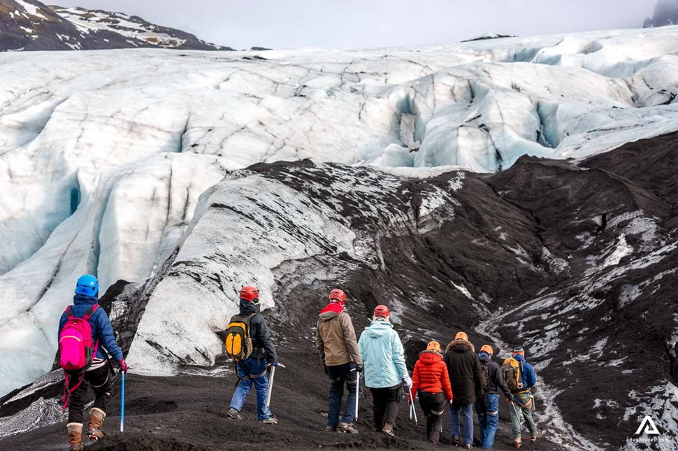 group of people glacier hiking on solheimajokull