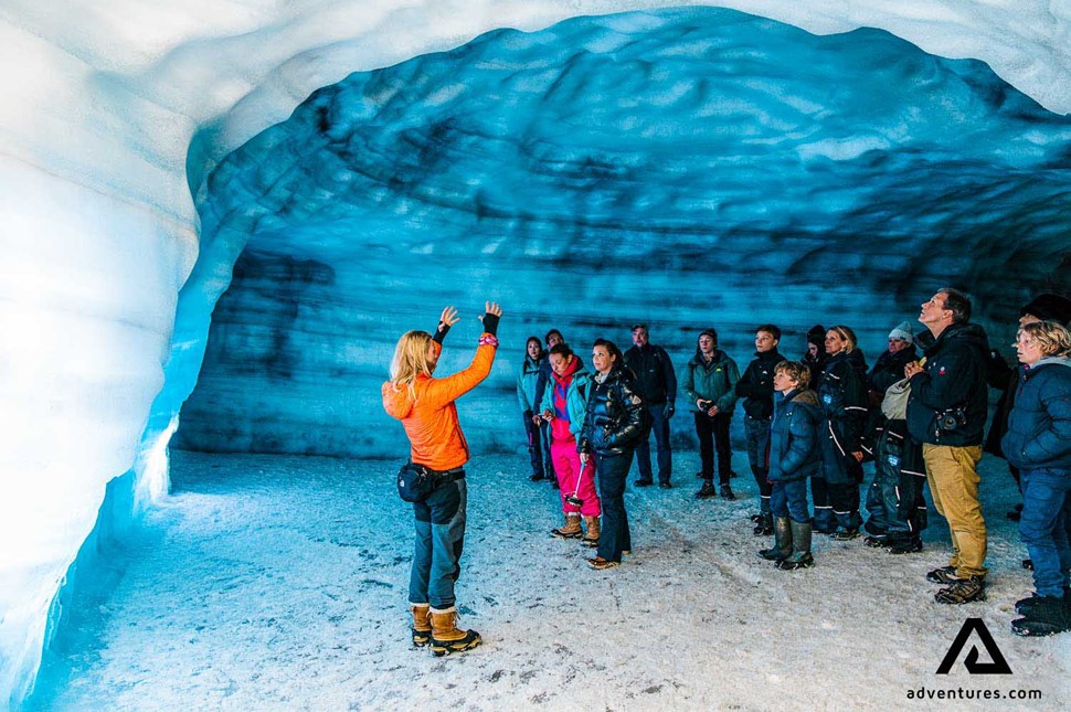 Ice Cave Guide People Into the glacier tunnel