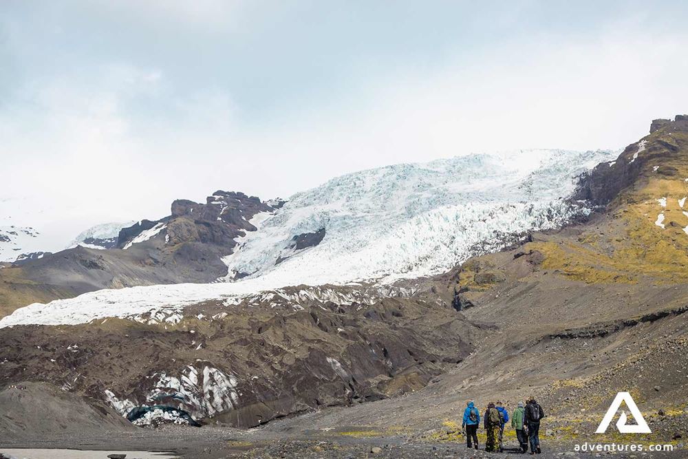 small group walking to a glacier