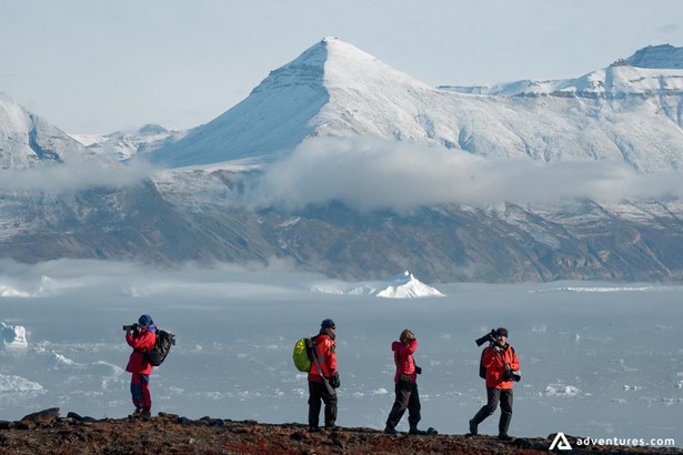 Group of tourists exploring Glacier Arctic