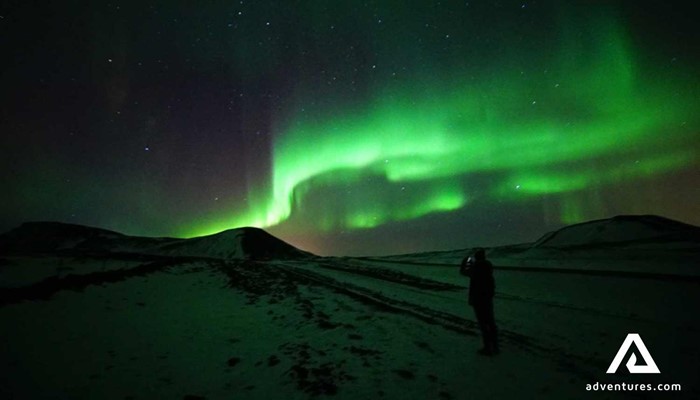 watching northern lights at night in iceland