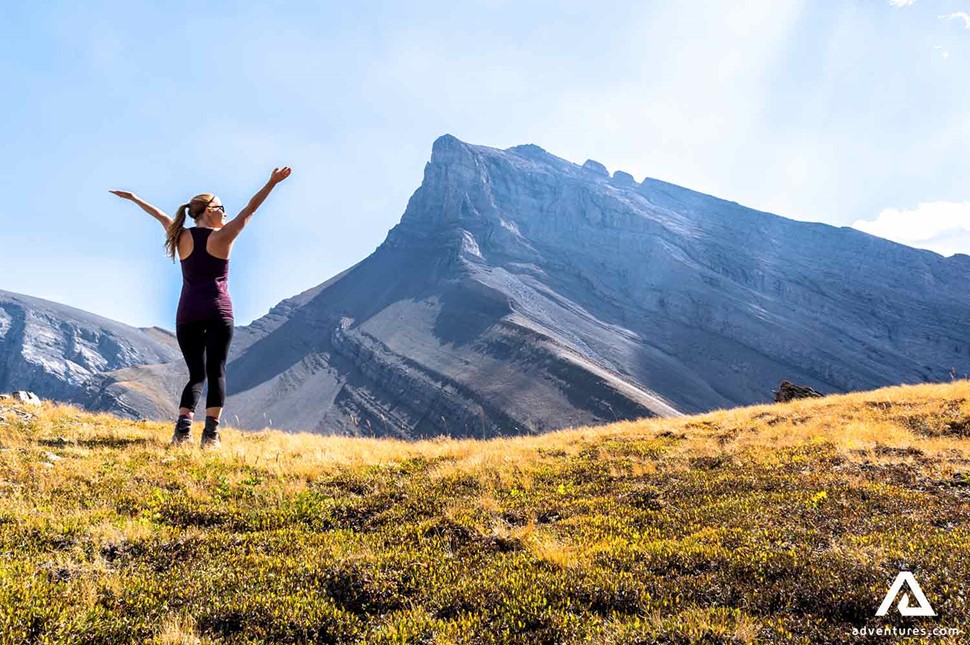 happy hiker near a mountain range in canada