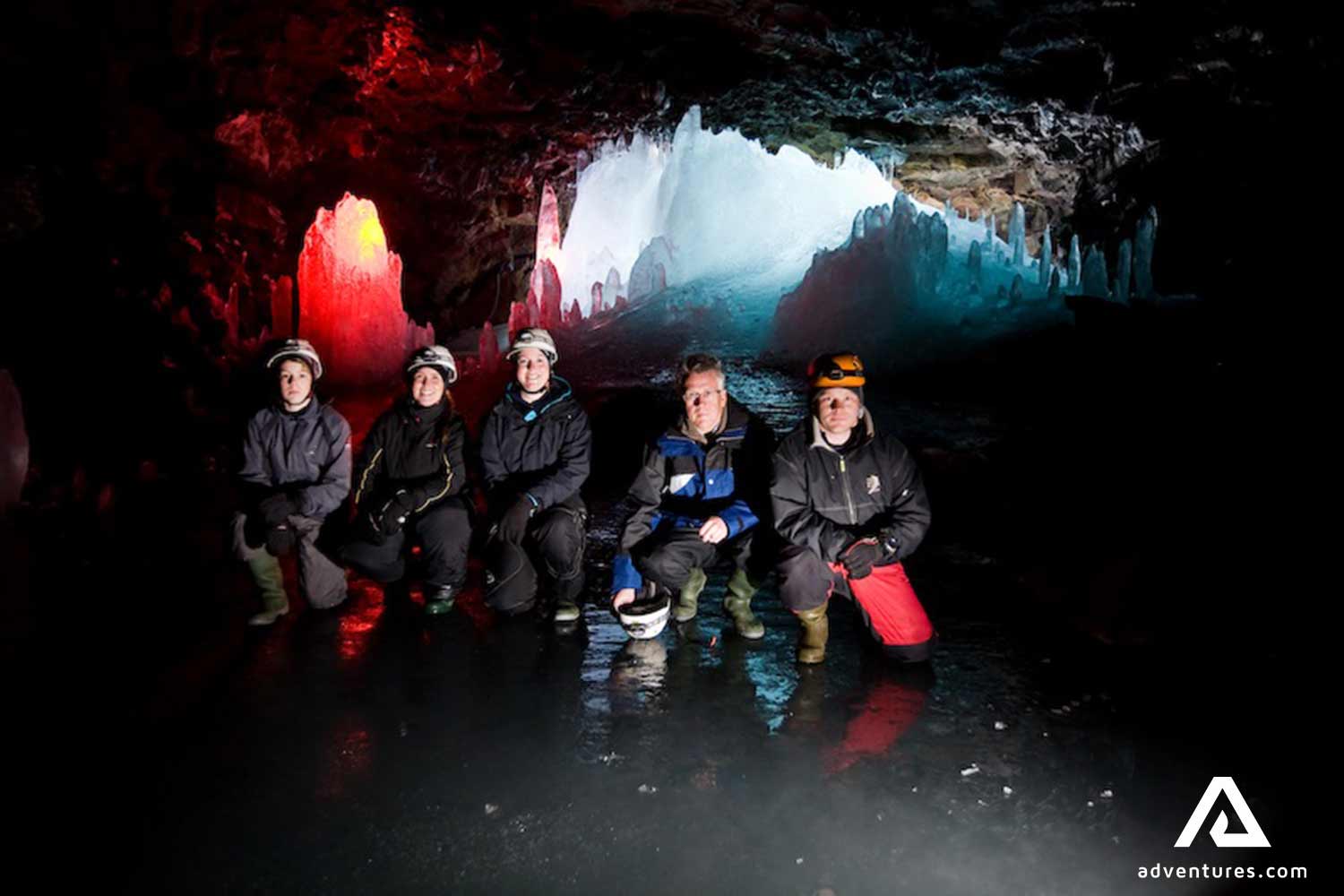 group posing for a picture inside Lofthellir lava cave