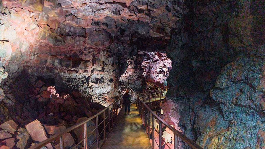 steel walking path inside a lava cave