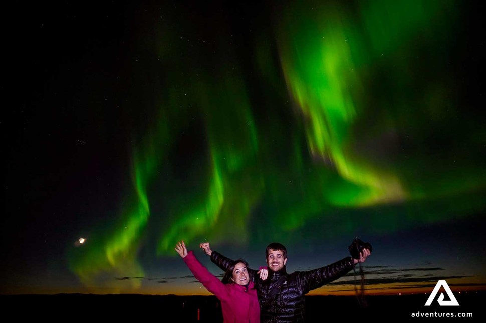 Happy Couple Watching Northern Lights Surprised Iceland