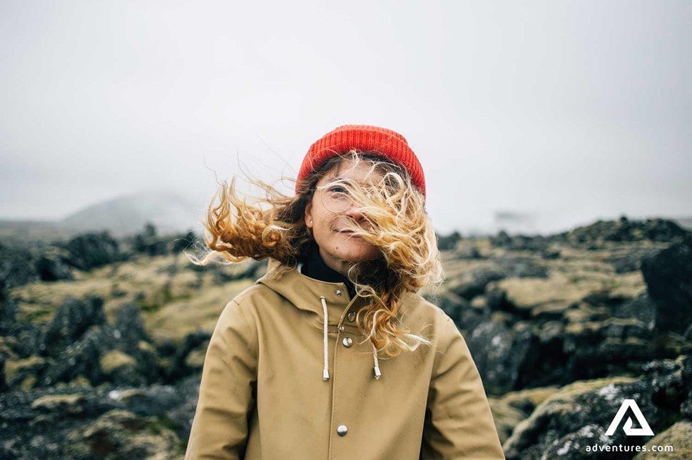 a woman in windy weather in iceland