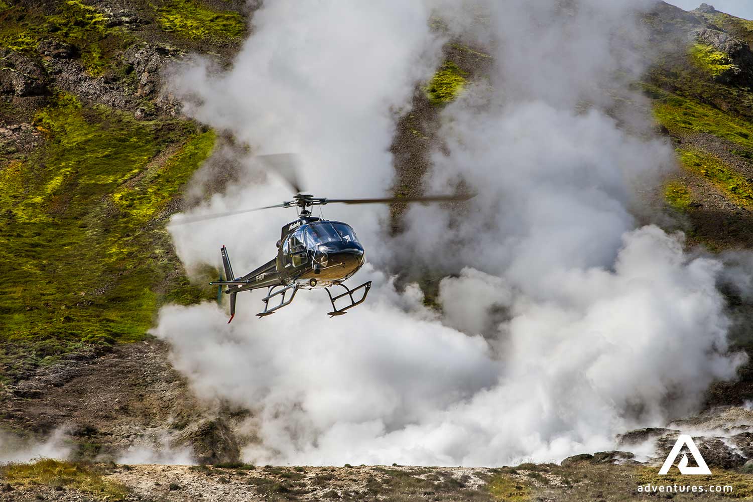 helicopter flying past geothermal area in hveragerdi in iceland