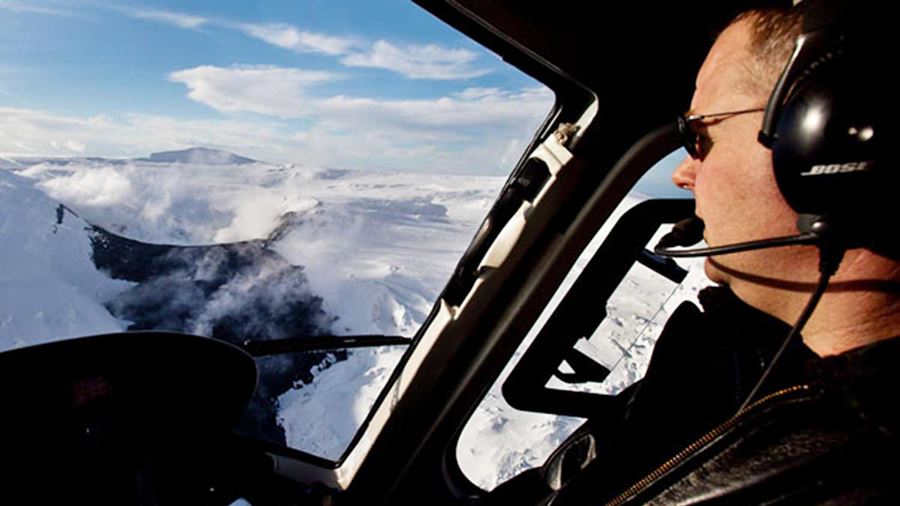 helicopter pilot looking at a geothermal area