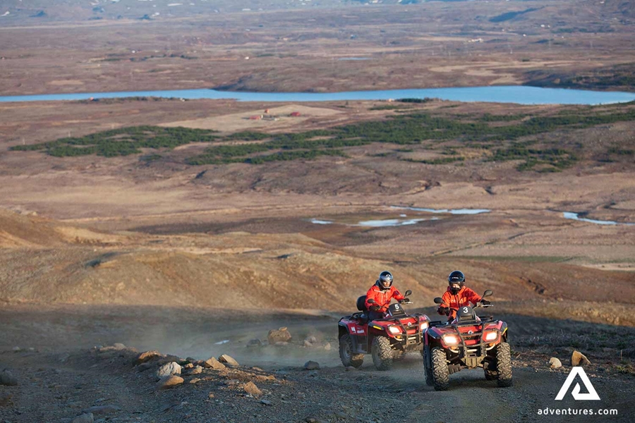 view from a mountain of people riding atvs