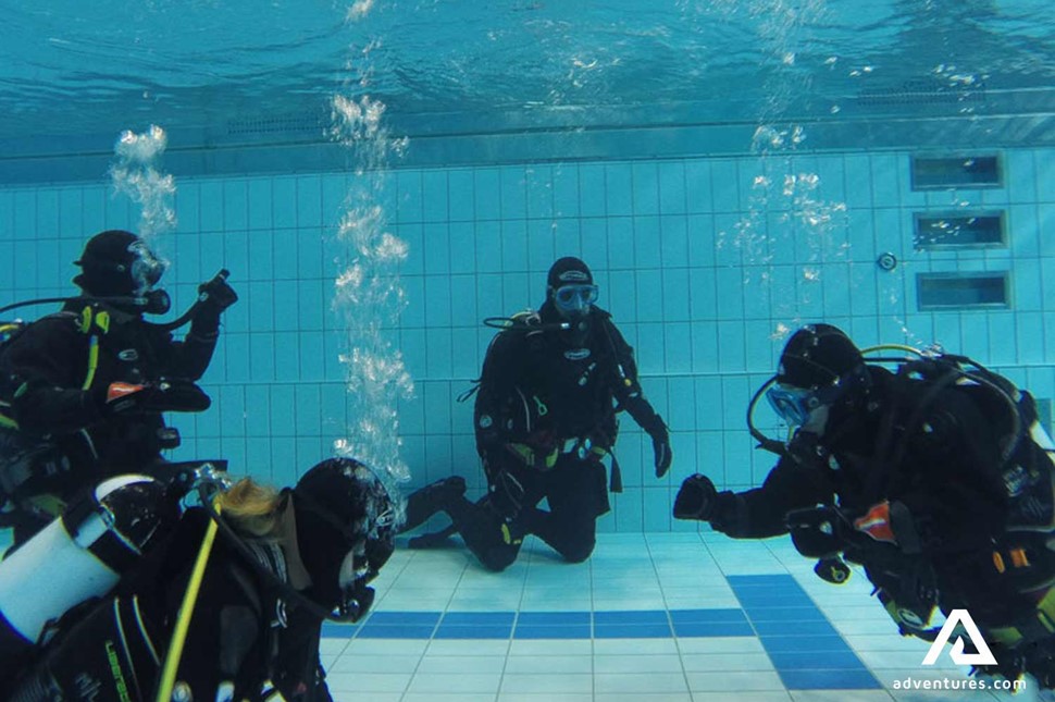 divers learning training in swimming pool in reykjavik