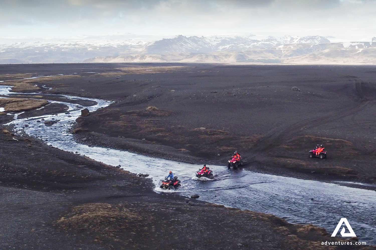 passing a river in a volcanic desert