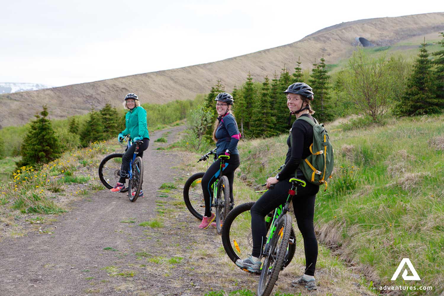 a small family biking around fjords in isafjordur iceland