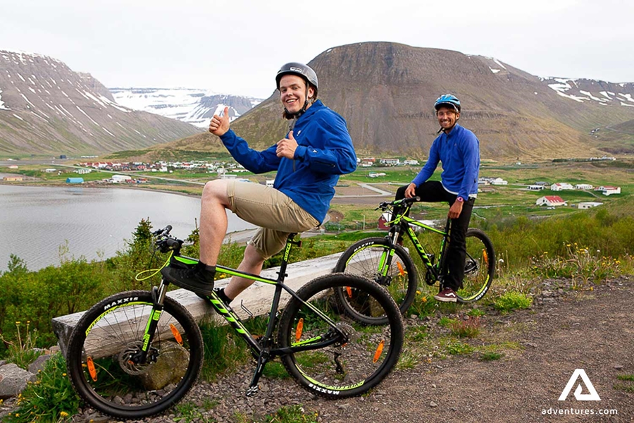 two happy friends on a mountain biking tour
