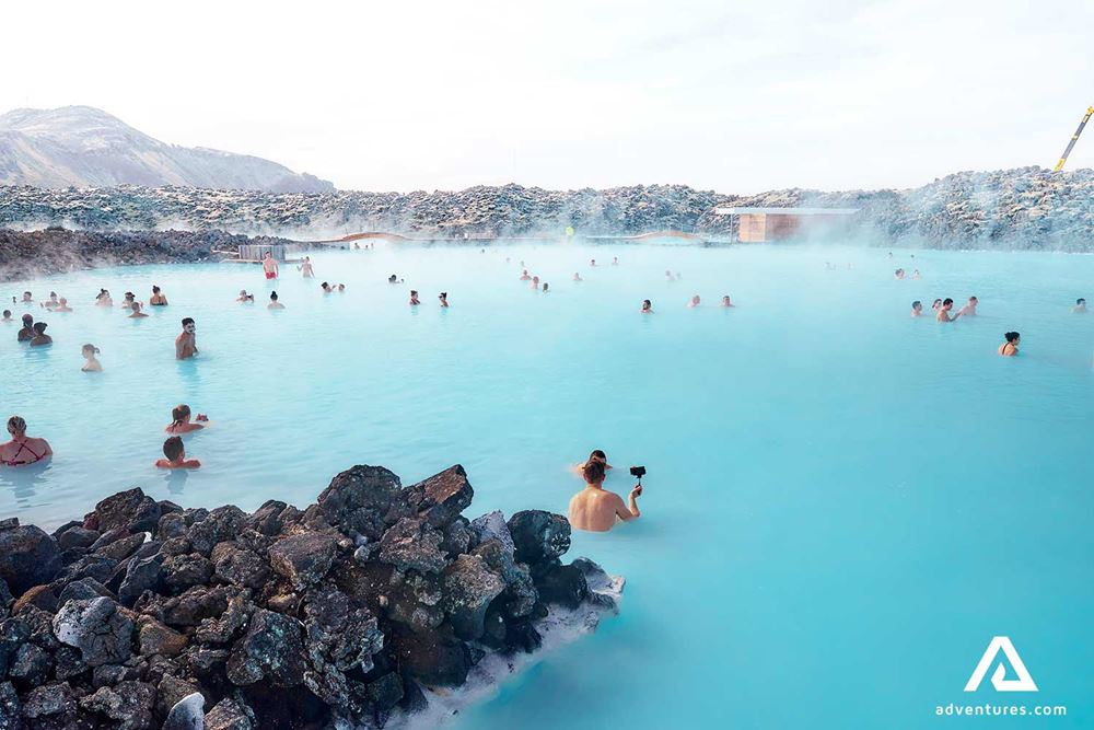 a lot of people bathing in the blue lagoon