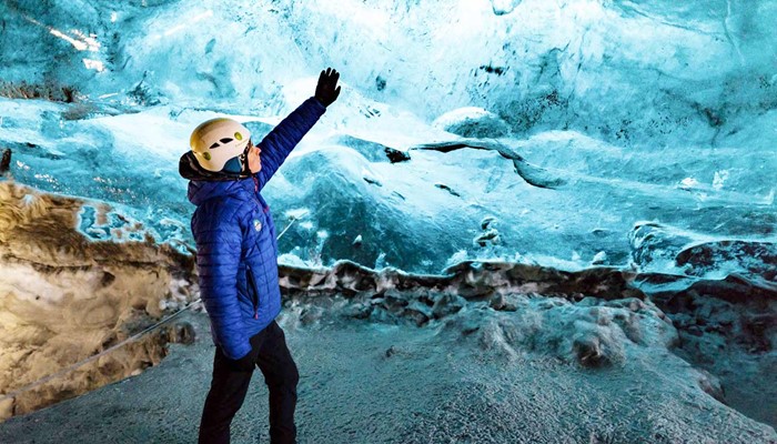 Touching the glacier inside the crystal ice cave