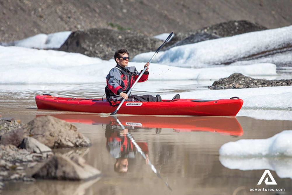 Man solo kayaking near Solheimajokull