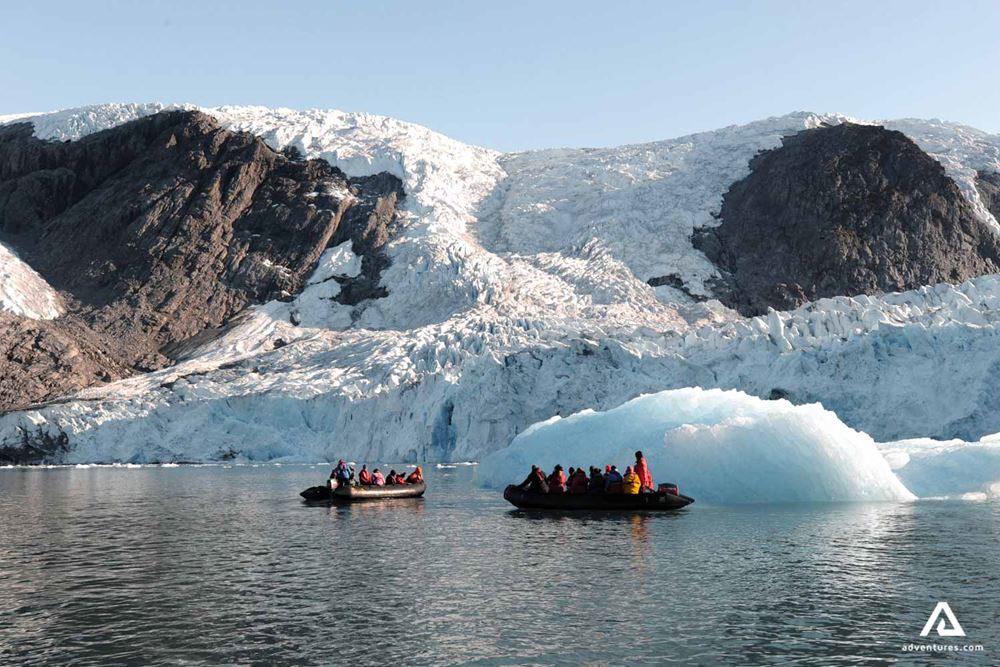 Exploring Greenland coast by a boat