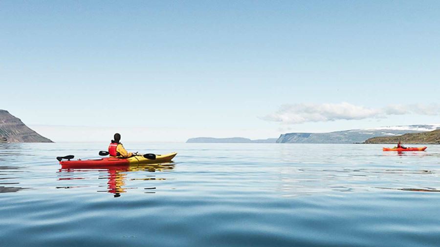 kayaking in a calm water sea