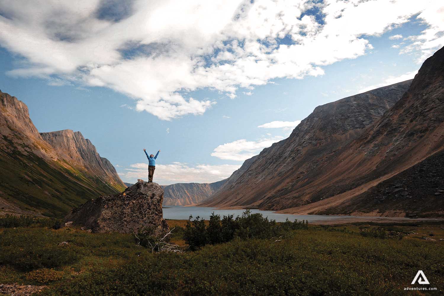 Traveler spread arms into the sky