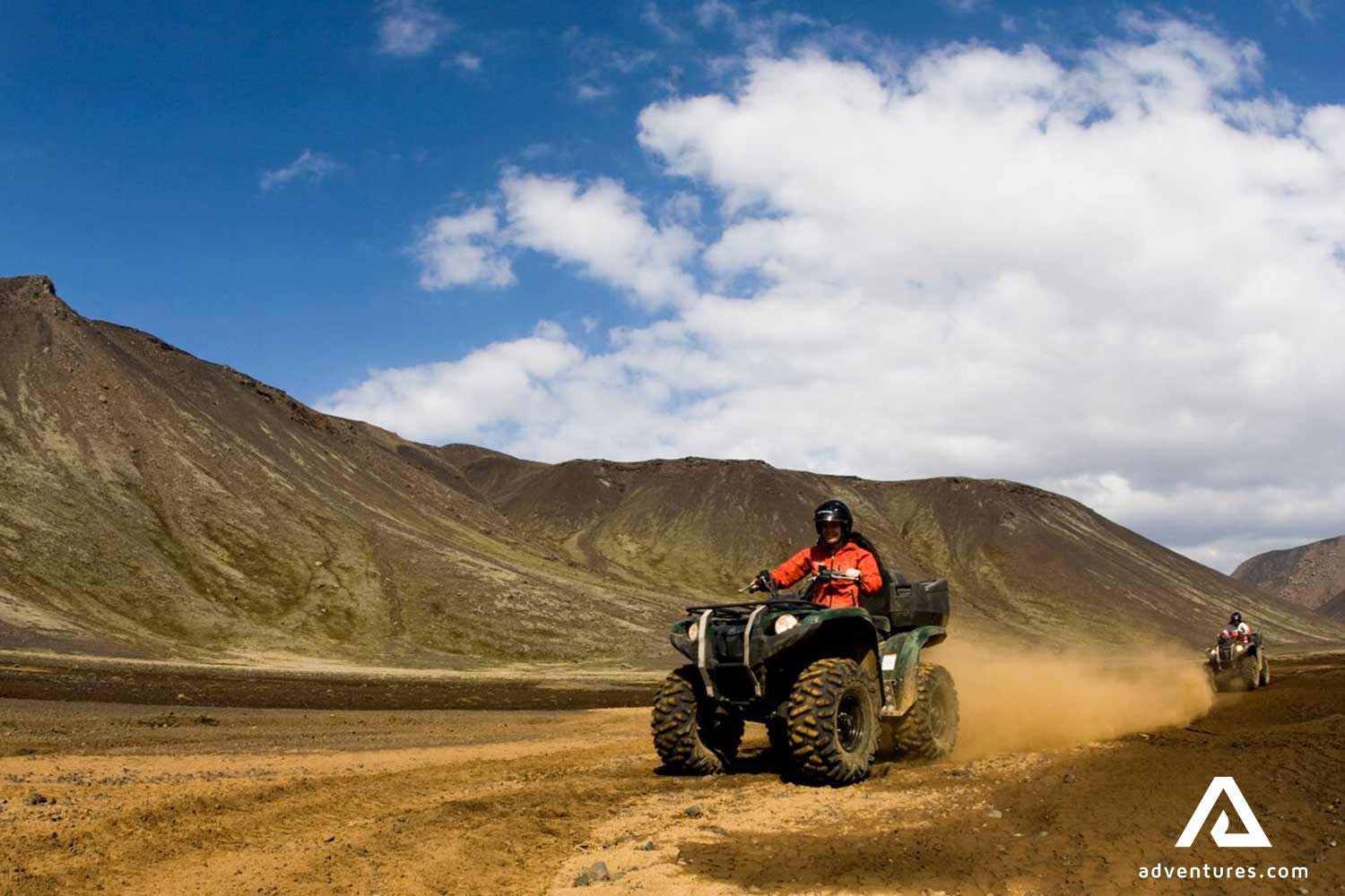 Fast ATV riding through gravel roads in Iceland
