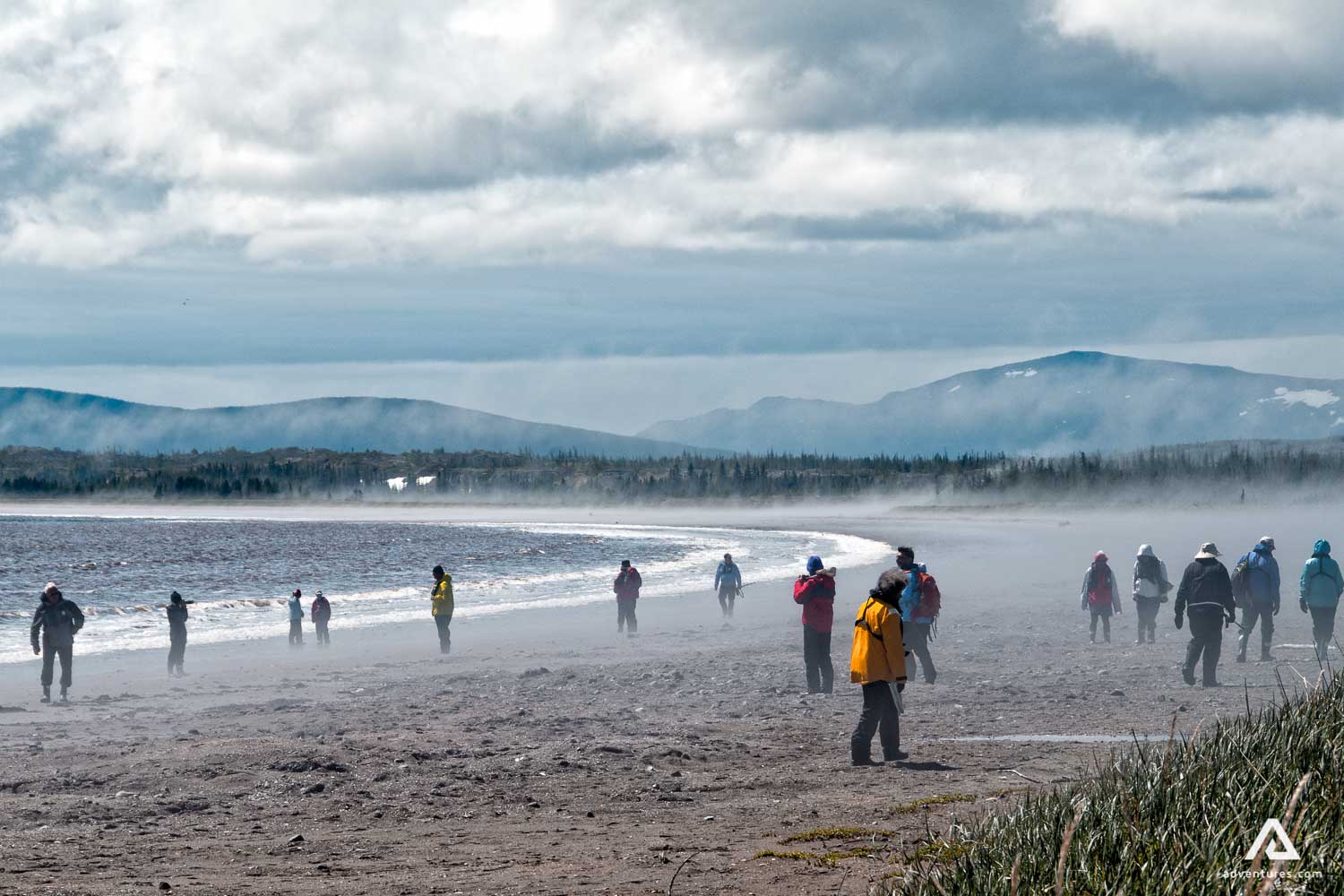 People walking along the beach