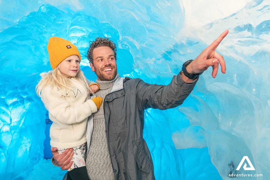 father and daughter in an artificial ice cave