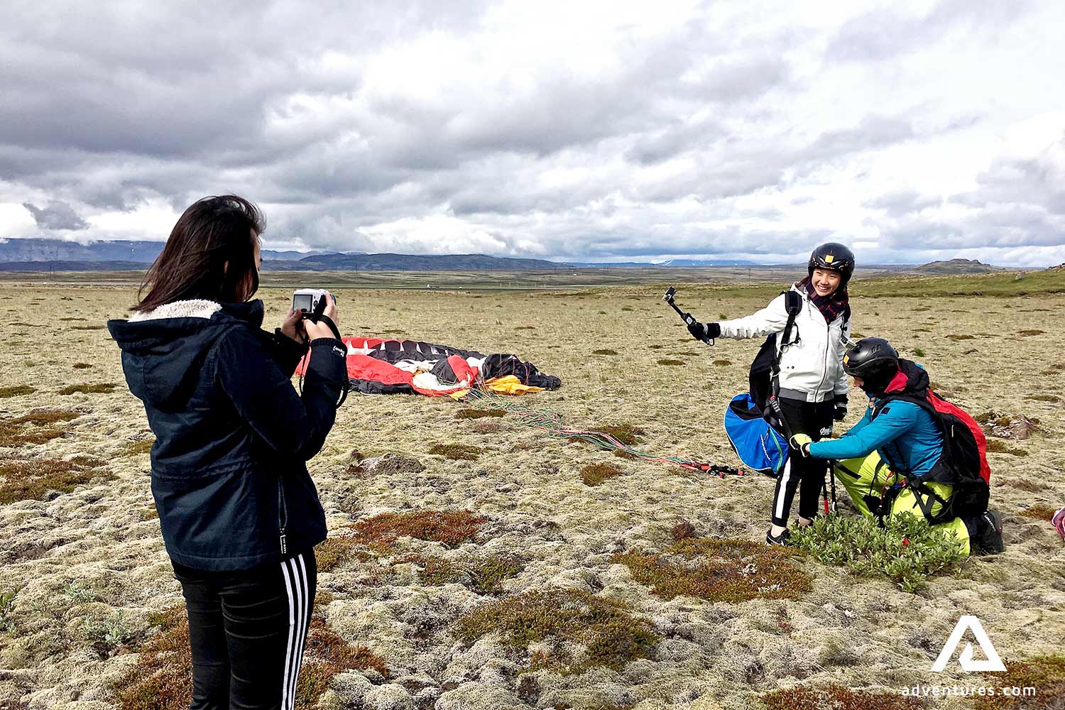 happy people after paragliding tour in iceland