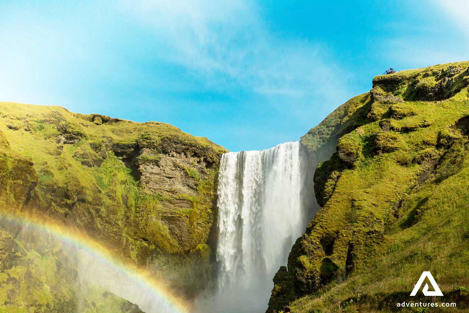 skogafoss waterfall with a rainbow in summer