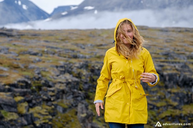 Girl with yellow jacket with a mountain view