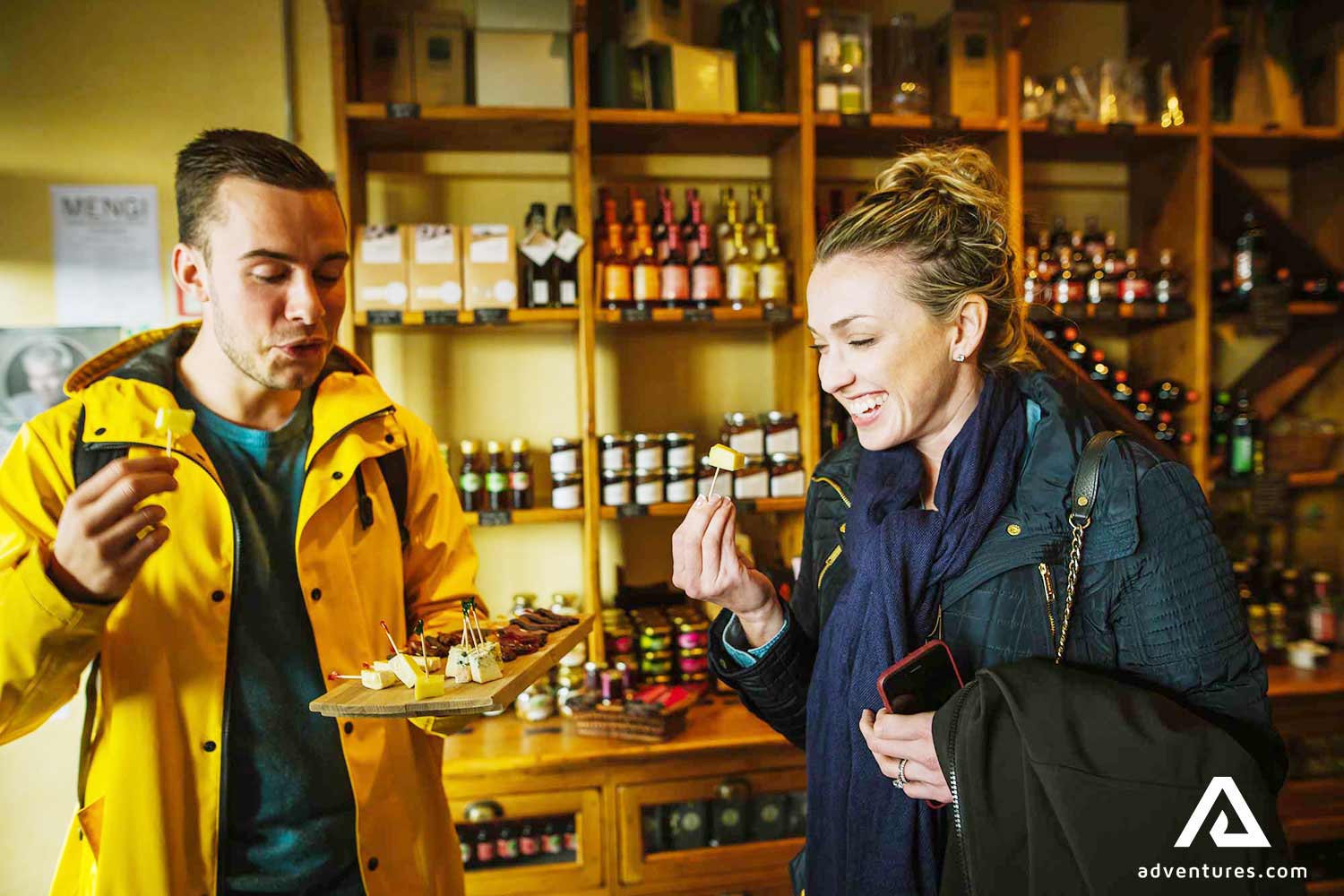 happy two friends tasting food