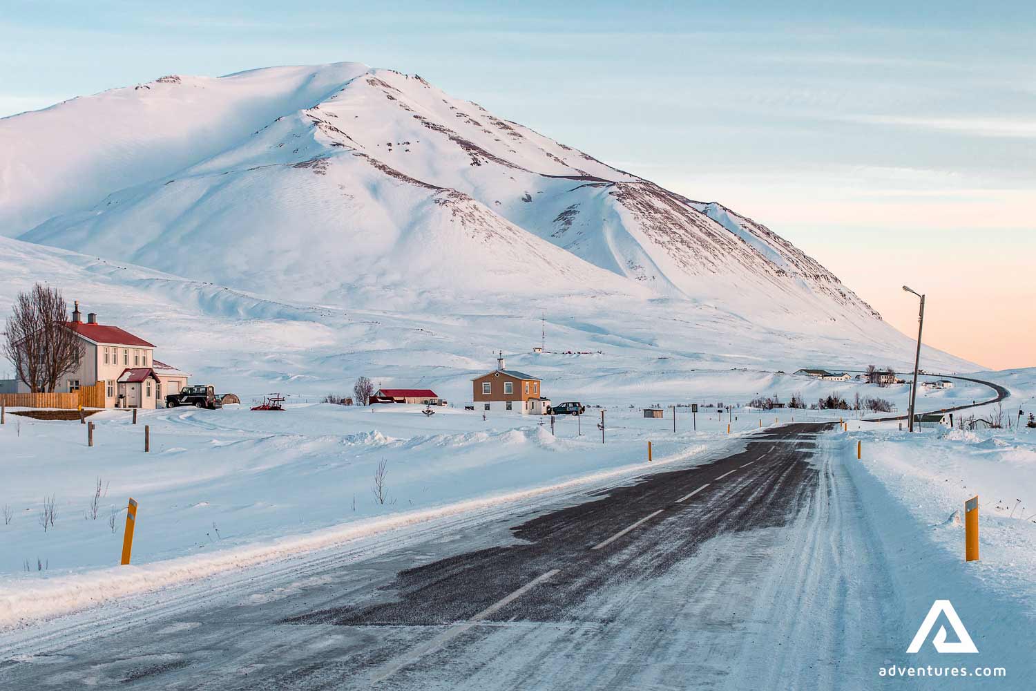snowy winter road near dalvik in north iceland