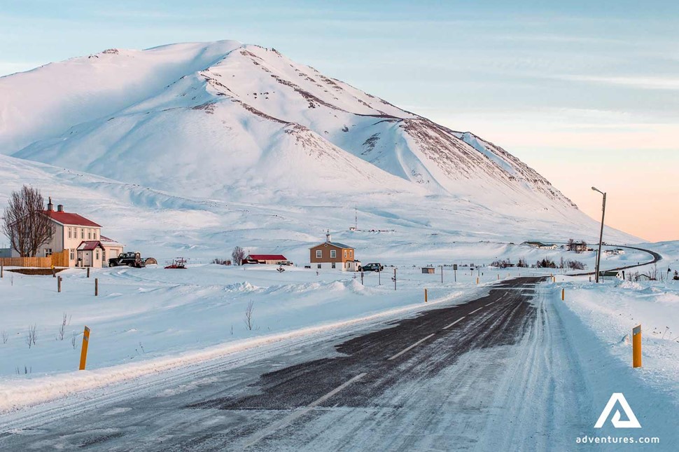 snowy winter road near dalvik in north iceland