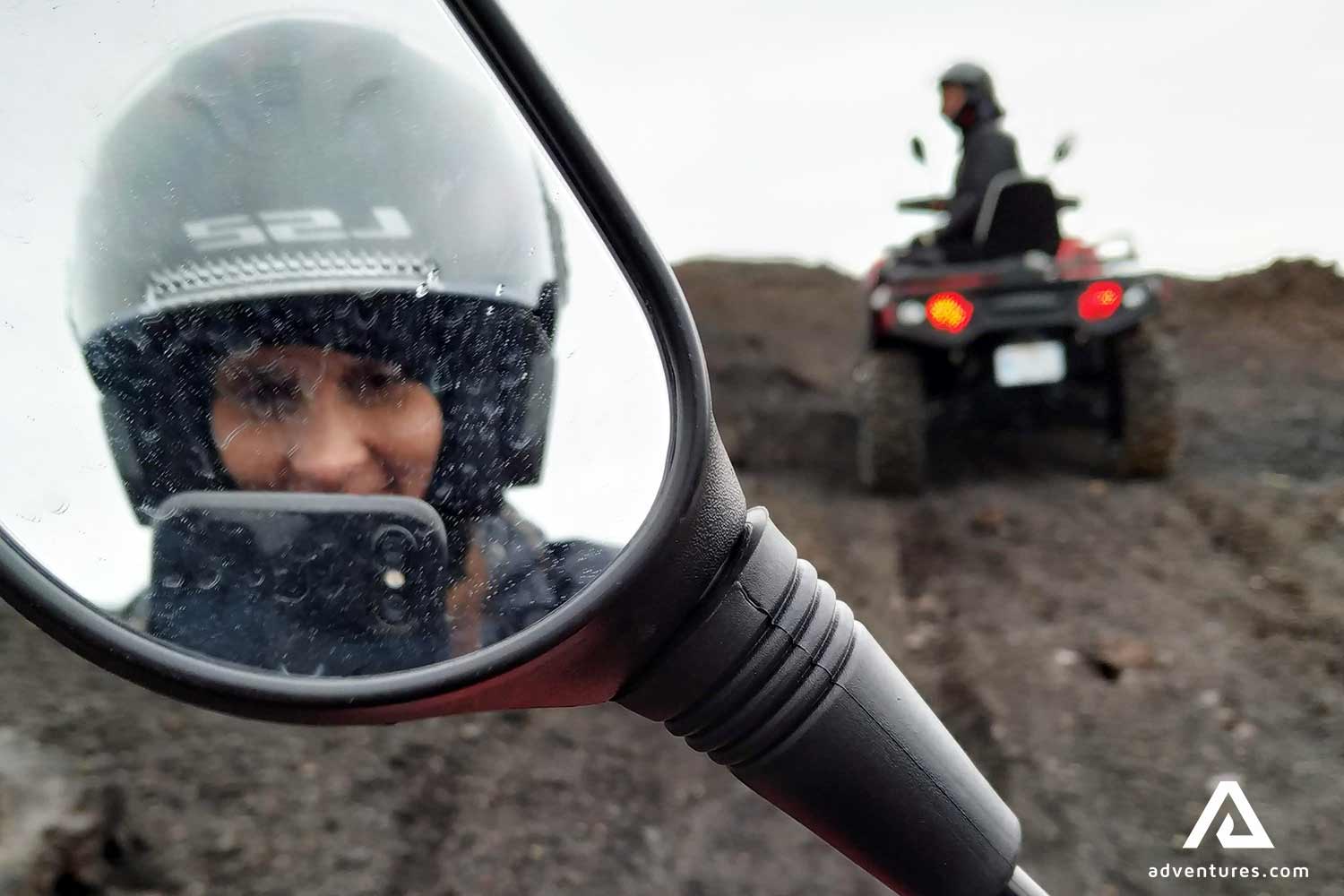 woman taking picture on an atv tour in south iceland