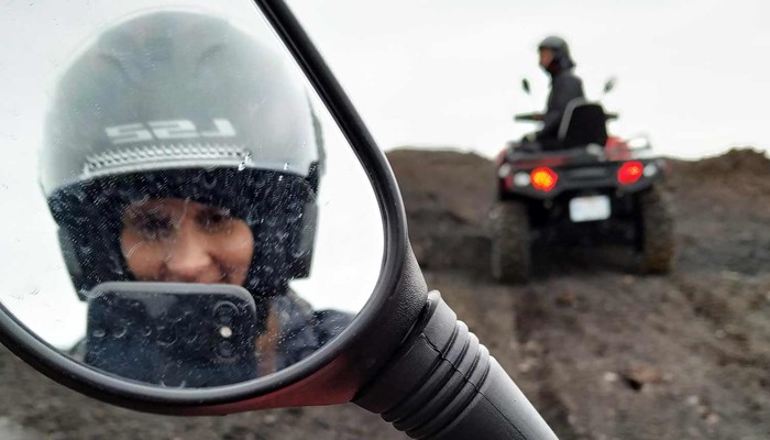 woman taking picture on an atv tour in south iceland