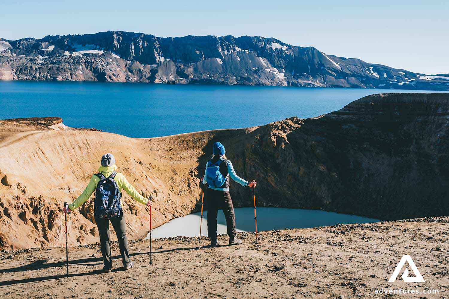 two people trekking Askja near Viti crater lake