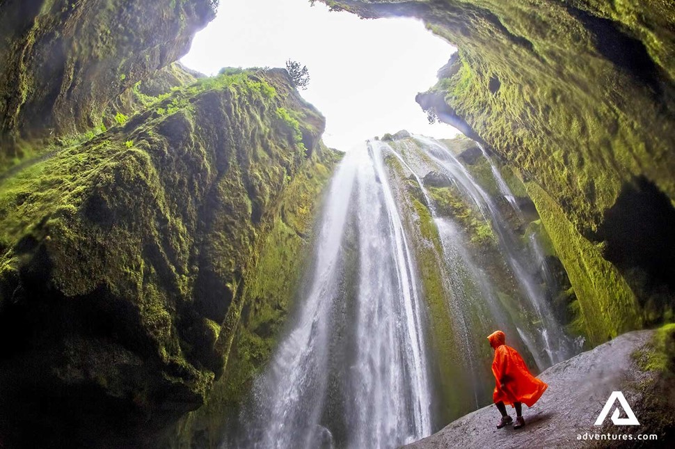 woman standing near gljufrabui waterfall