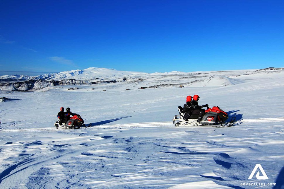 People with fast snowmobiles in Iceland