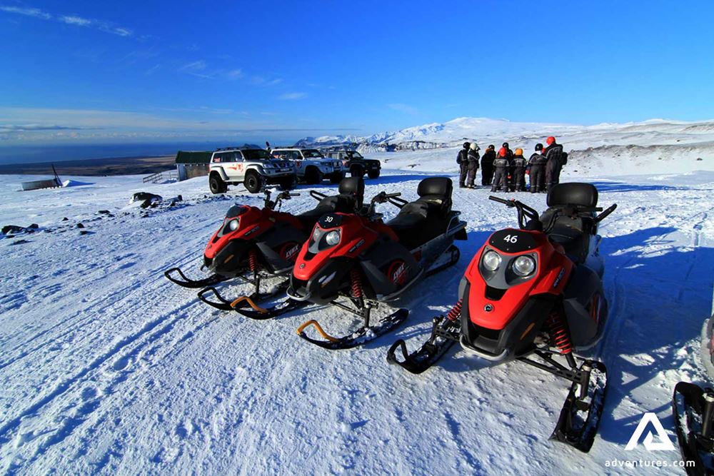 red snowmobiles on Myrdalsjokull