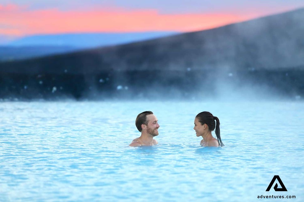 smiling couple inside the blue lagoon spa