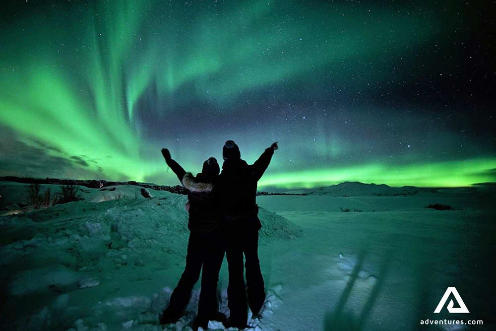 pointing at bright northern lights